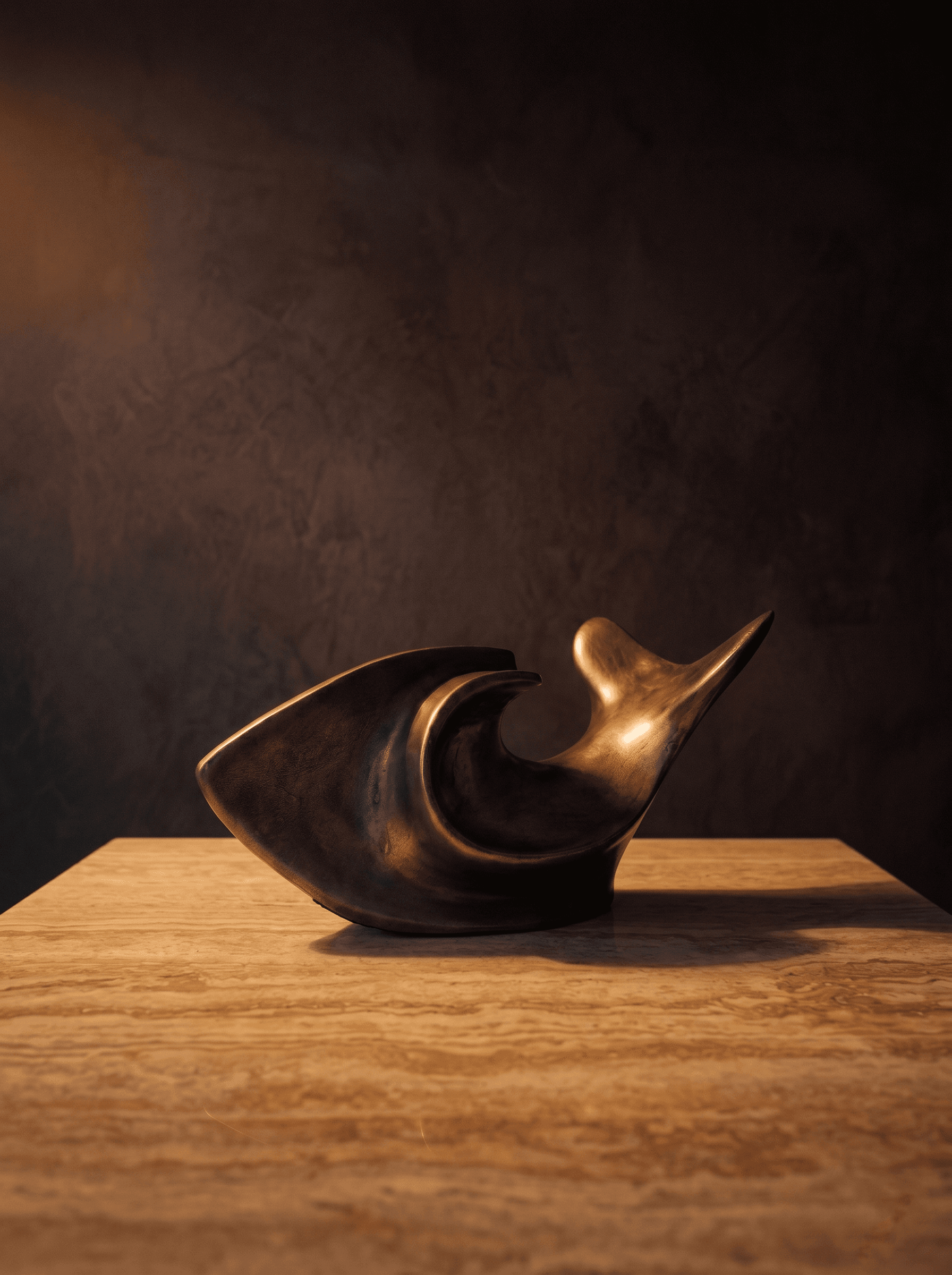 Matsya staged on a pedestal in a warm dark evening alcove — the intersection of computational design and artisan craft rendered as a single resolved piece in an atmospheric gallery setting